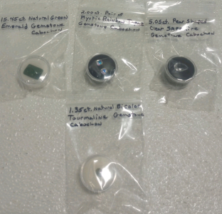 (1) 15.45ct Natural Green Emerald Cabochon (2) Mystic Rainbow Topaz Gemstone Cabochon (1) 5.95ct Pear Shaped Sapphire Cabochon (1) 1.35ct Natural Bi color Tourmaline Gemstone