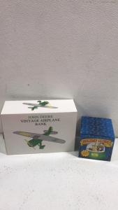 (1) John Deere Vintage Airplane Bank (1) John Deere Singing Holiday Globe