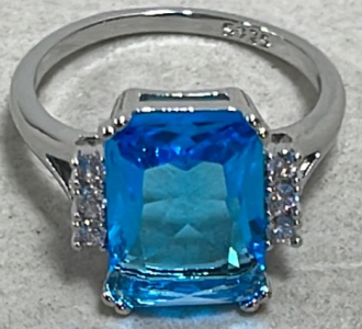 (1) Emerald Cut Blue Topaz .925 Ladies Ring Size 9