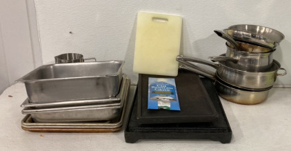 Various Kitchenware Products Including Baking Trays, Cutting Board, Griddle Trays, Pots, Pans, Cut Resistant Glove And More