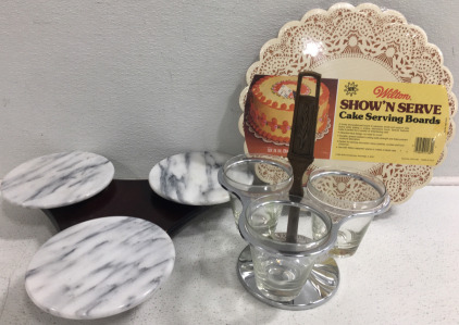 (1) Marble Lazy Susan (1) Glass Condiment Lazy Susan (1) Package of (6) 14&rdquo; Cake Serving Boards