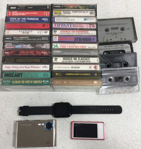 (1) Smart Watch (1) Samsung NV3 Camera (1) IPod (28) Assorted Tapes
