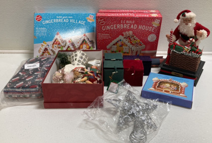 (3) Gingerbread House Kits, Assorted Ornaments, Christmas Goody Bags, Star Tree Topper, Christmas and New Year Banners, Animatronic Santa