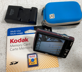 (1) Nikon Coolpix S230 Camera With Battery & Charger (1) Kodak 2GB Memory Card New (1) Camera Case