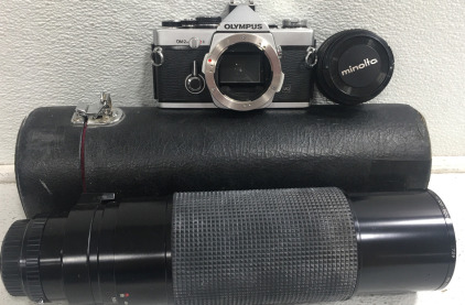 (1) Ricoh 500mm Camera Lens w/Case (1) Olympus OM-2 Camera W/Case (1) Minolta Lens