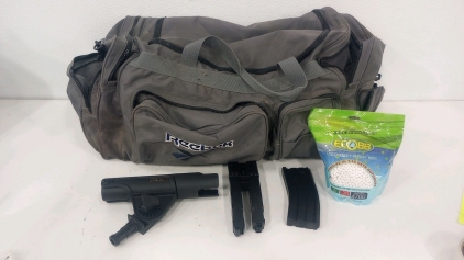 (1) Large Vintage Reebok Duffle Bag (2) Air Soft Rifle Magazines (1) Cabela's Fishing Rod Holder (1()Bag Of (4700) Ecobb .20gram Airsoft Bbs