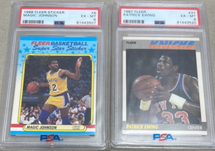 (1) 1988 NBA Fleer Sticker Magic Johnson PSA Graded #6 EX-MT, (1) 1987 NBA Fleer Patrick Ewing PSA Graded #37 EX-MT, Both Are Carded And Sleeved