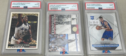 (1) 1993 Topps Black Gold Shaquille O&rsquo;Neal PSA Graded #18 VG-EX, (1) 1995 SP Championship Kevin Garnett Champions Of The Court PSA Graded #C16 EX-MT, (1) 2015 Panini Prizm Kristaps Porzingis PSA Graded #348 Mint. All Are Carded And Sleeved
