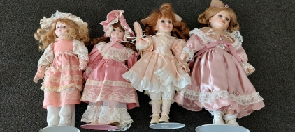 Collectable Porcelain Dolls and one Hard Plastic Collectable Doll