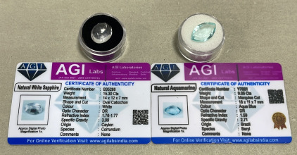 (1) 15.30ct Natural White Sapphire Oval Cabochon, (1) 9.05ct Natural Aquamarine Marquise Cut And Faceted. Both W/ AGI Labs COA