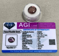 (1) 9.50ct Natural Rhodolite Garnet Round Cut And Faceted, (1) 4.45ct Natural Montana Sapphire Oval Cut And Faceted. Both W/ AGI Labs COA - 2