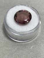 (1) 9.50ct Natural Rhodolite Garnet Round Cut And Faceted, (1) 4.45ct Natural Montana Sapphire Oval Cut And Faceted. Both W/ AGI Labs COA - 4