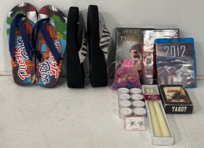 (1) Pair Of Flip Flops Around Men’s Size 10, (1) Pair Of Women’s Flip Flops Size 9M, (3) Movies Blu-Ray And DVD, (1) Deck Of Fool Tarot Reading Cards, (2) Luminessence Taper Candles Unscented, (8) Mini Candles