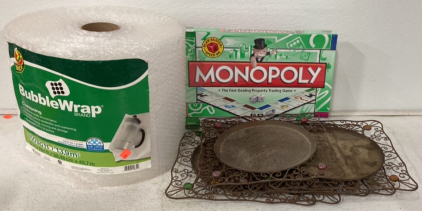 (1) 150Sqft Of Duck Bubble Wrap, (1) Never Opened Monopoly Board Game, (6) Metal Garden/Home Decorations