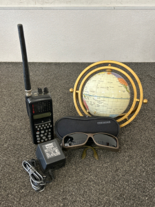 Cocoons Sunglasses, Decorative Globe, and Handheld Scanner (Powers On)