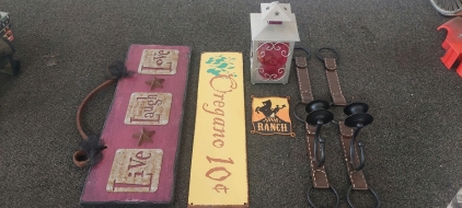 Western feel home decor - Metal signs, candle lantern, & wall candle holders.