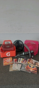 Small maroon purse. Table fans. Gatorade bottle holder. Bike Foot Pump. Variety of CD's.