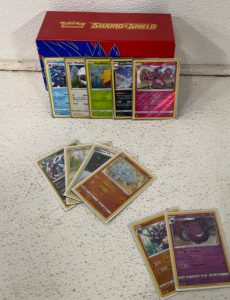 (100+) 2020-2021 Pok&eacute;mon Cards Including Holographics, Card Sleeves, Flipping Coins And More