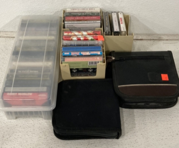 (28) Late 1900s Cassette Tapes, (2) CD Holder Bags With Sleeves