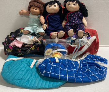 (1) Cabbage Patch Doll, (2) Soft Dolls, (2) Small Duffel Bags w/ Doll Clothes, (2) Soft Doll Carriers